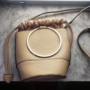 Elegant Beige Bucket Bag with Gold Ring Accent